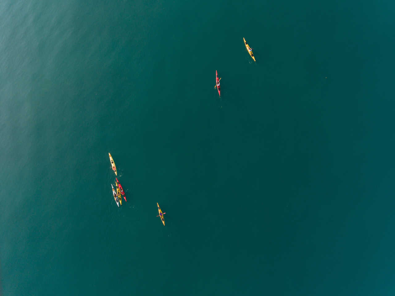 Drone view of a group of kayakers in the Mediterranean Sea