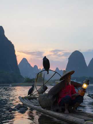 Pêcheur sur la rivière Li, Yangshuo, Guilin